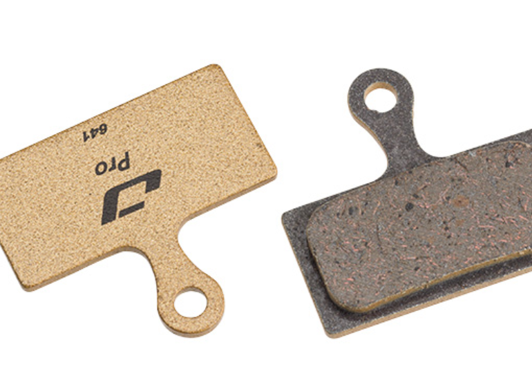 Composite materials disc brake pad backing plate